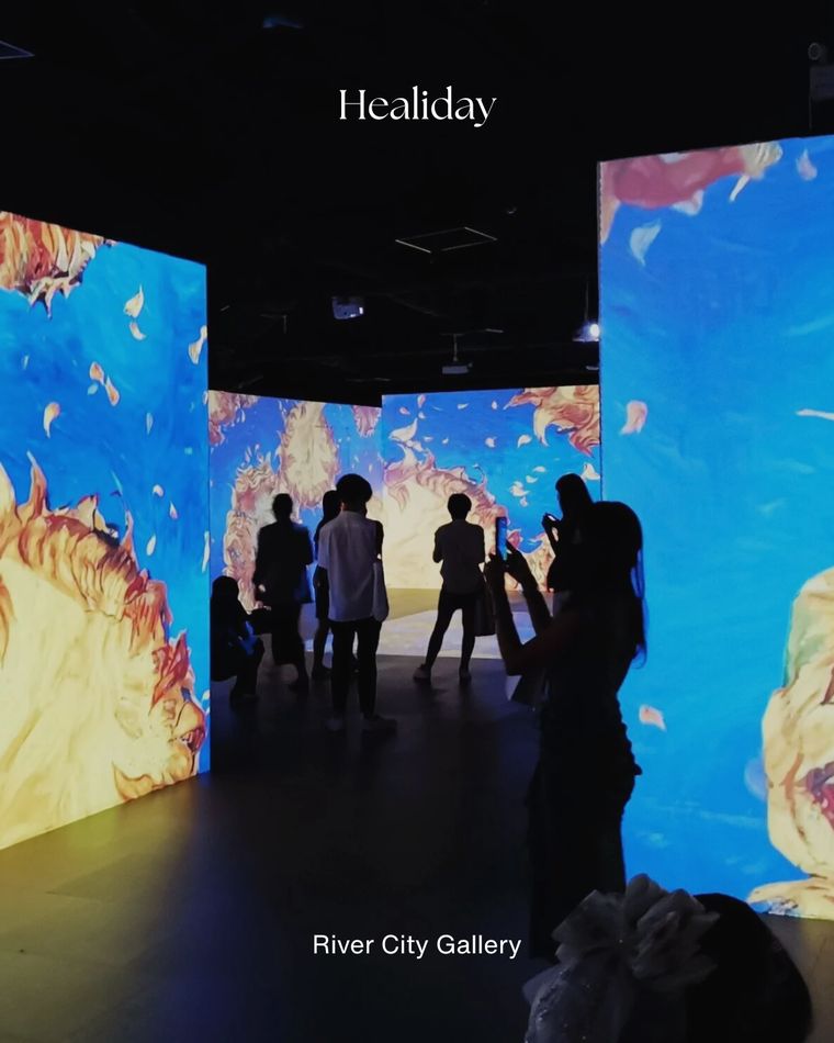 Visitors inside an immersive digital art show at River City Gallery, Bangkok